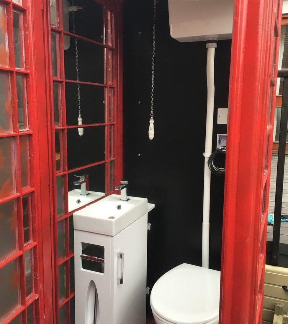 A phone box converted to a lavatory