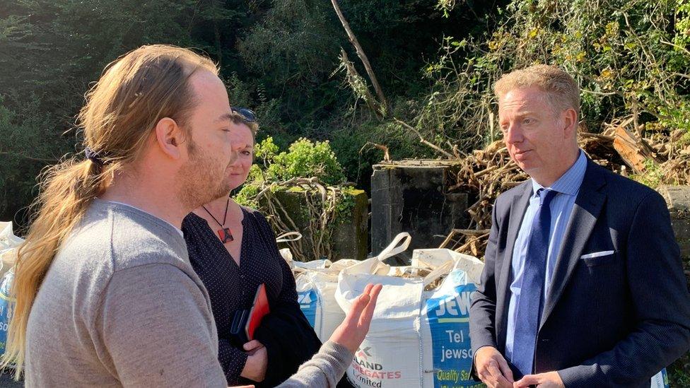 Alex Allison speaking to a Laxey resident