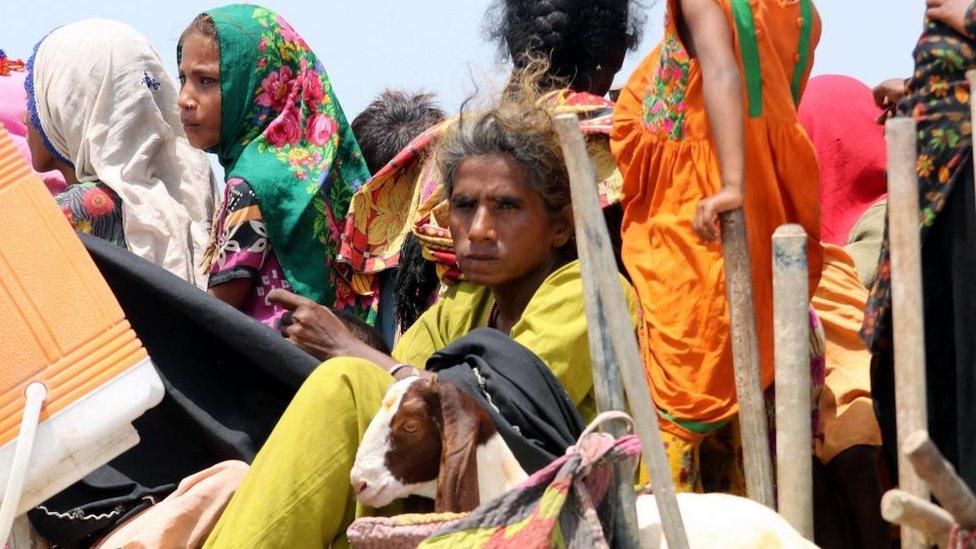 People affected by monsoon rains and floods move to higher grounds in Sanghar district, Sindh province, Pakistan, 28 August 2022.