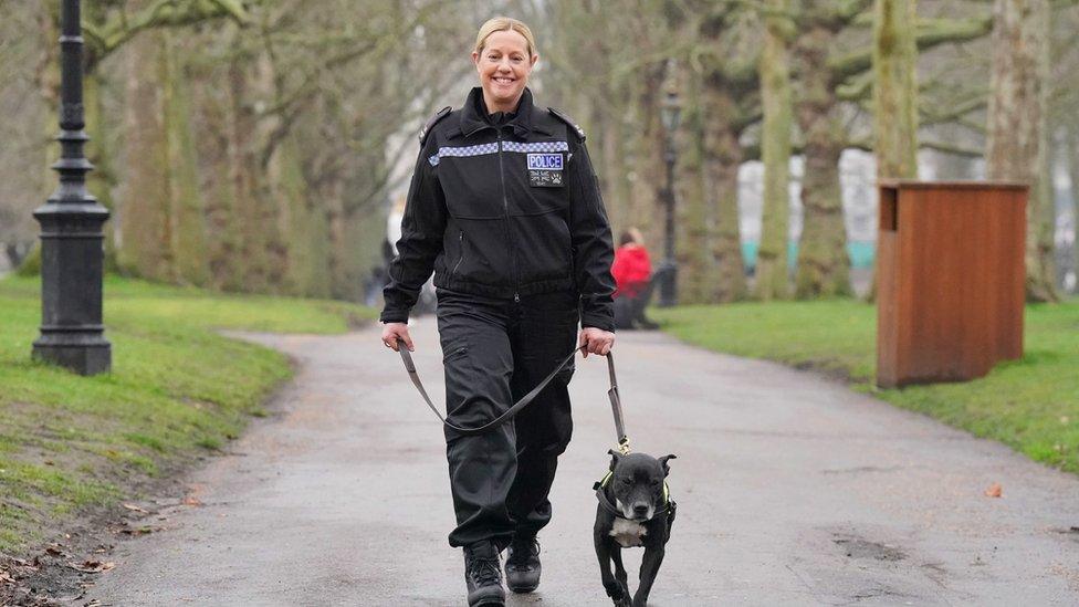 PC Claire Todd and recently retired Gloucester Police Staffordshire Bull Terrier Stella, one of the finalists for the prestigious Crufts canine hero award, at a launch event in Green Park, London, for Crufts 2023 and The Kennel Club's Hero Dog Award.