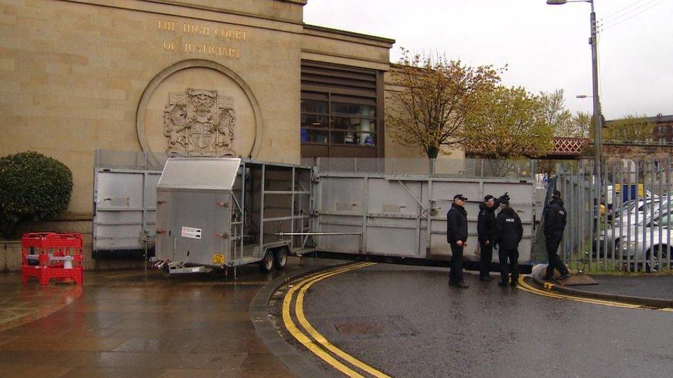 Police at barrier created at court