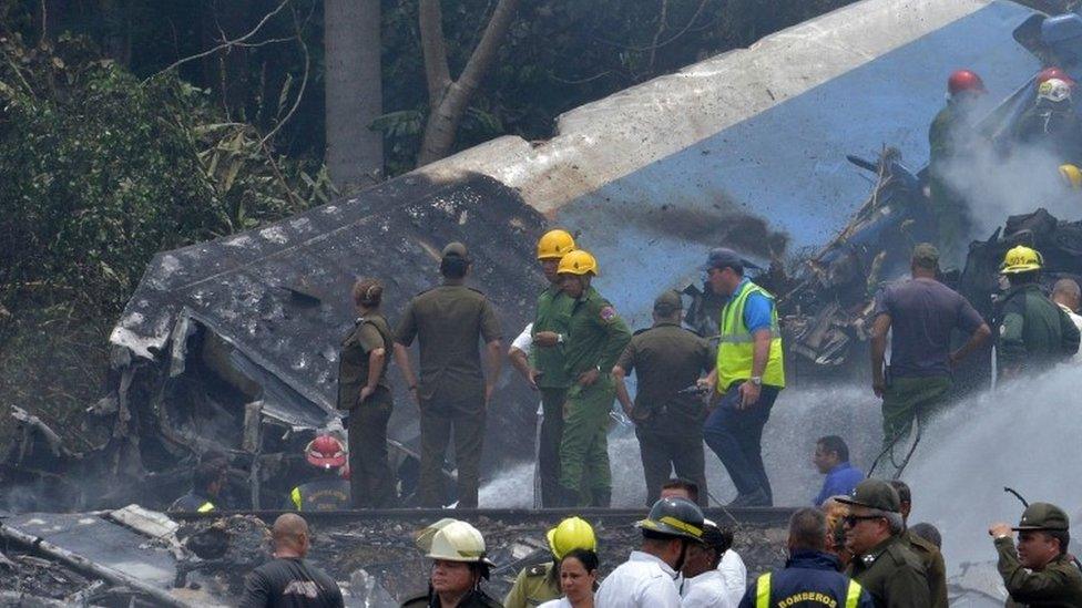 Emergency personnel work at the site of the accident on 18 May 2018.