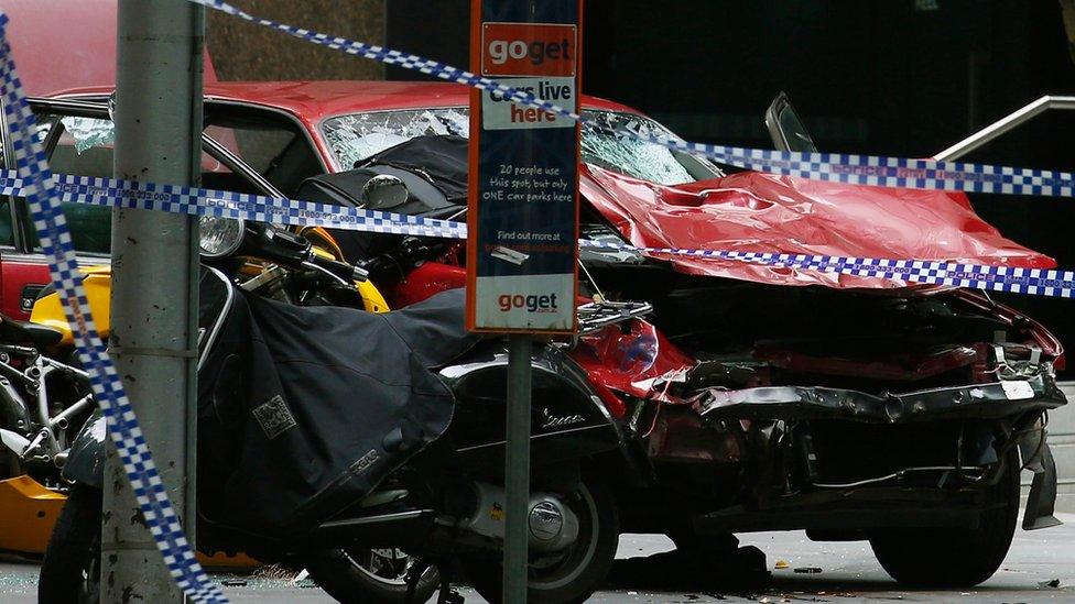 The wreckage of a car is seen as police cordoned off Bourke Street mall, after a car hit pedestrians in central Melbourne, Australia, January 20, 2017