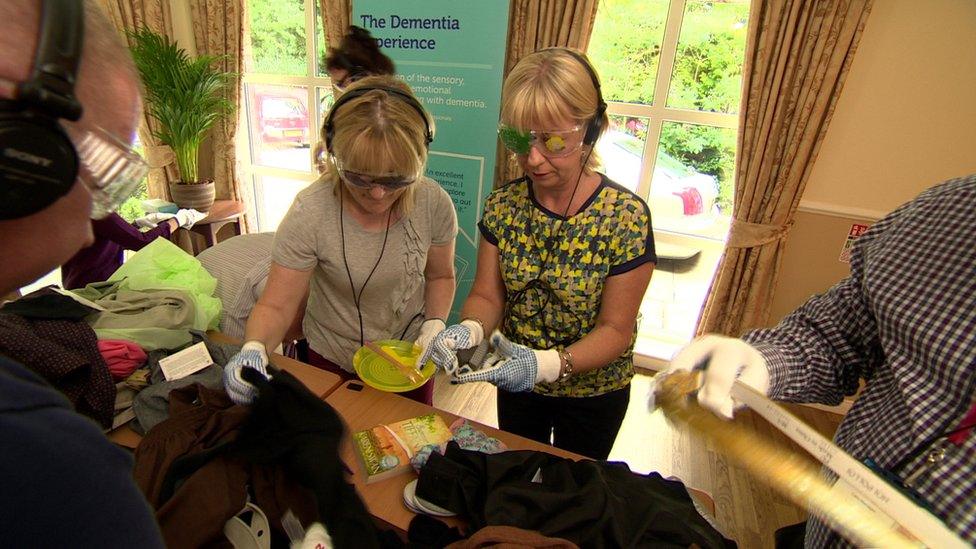 Marie-Louise Connolly and a care worker try the new dementia care training