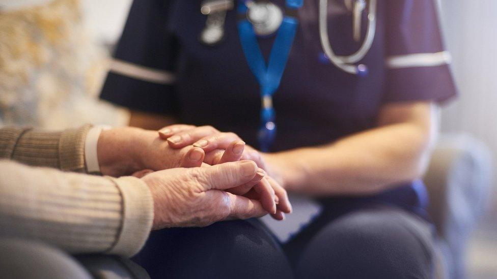 Elderly person with nurse