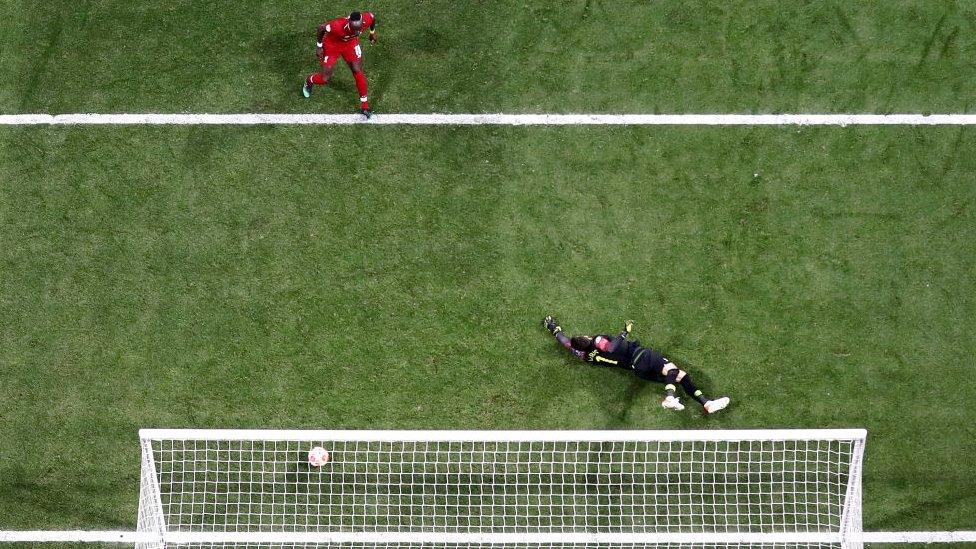 Hugo Lloris of Tottenham dives to save ball