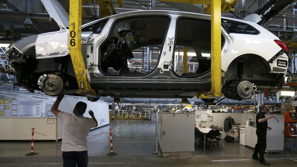 Employees work on the Astra production line at the Vauxhall Motors plant in Ellesmere Port