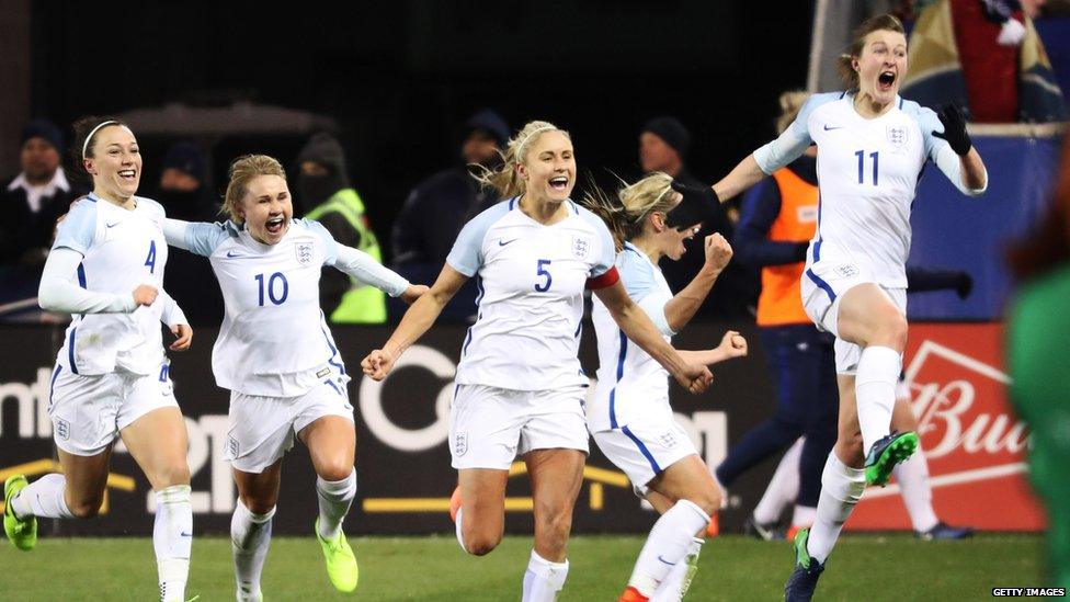 Ellen White celebrates scoring a goal for England