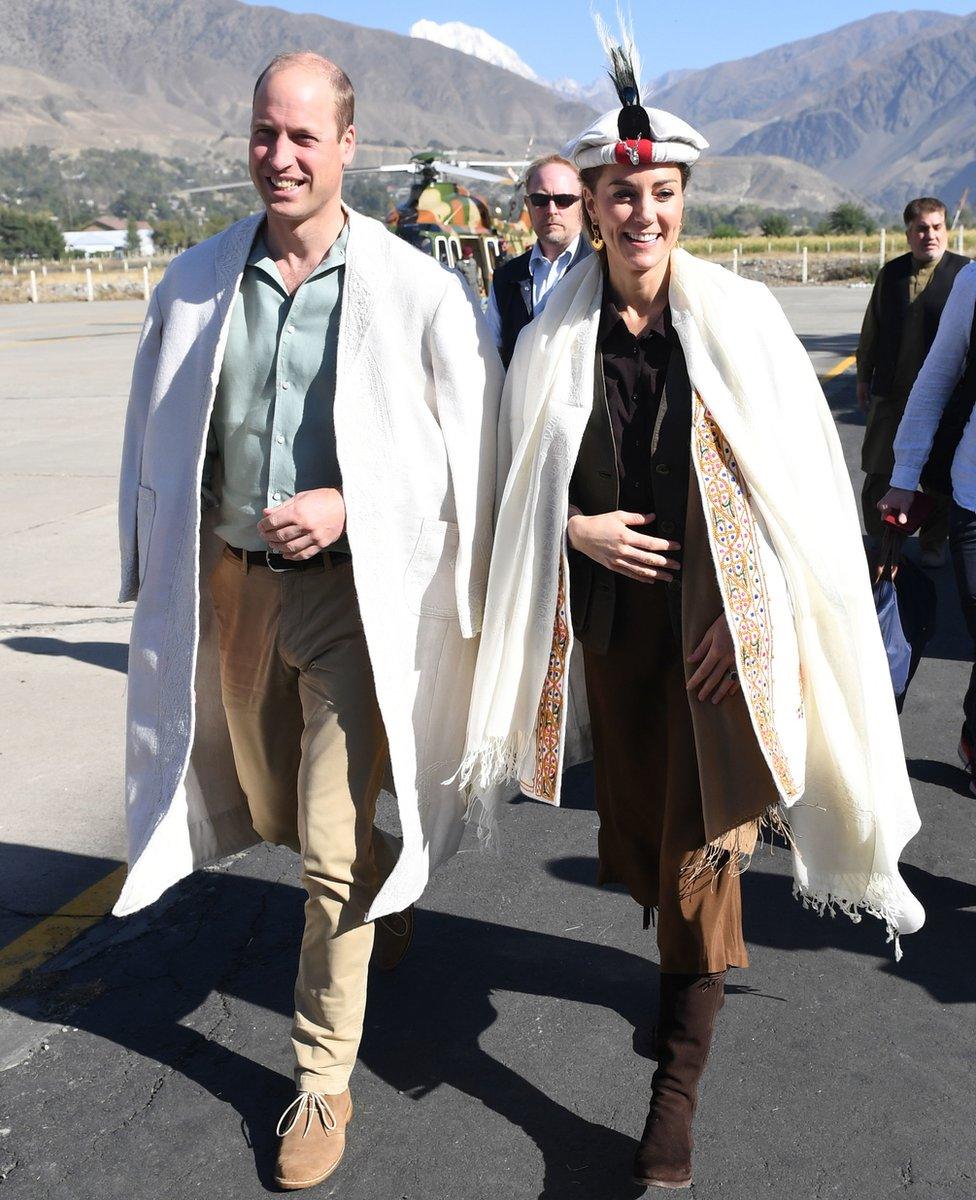 The Duke and Duchess of Cambridge arrive in traditional dress at Chitral in Pakistan