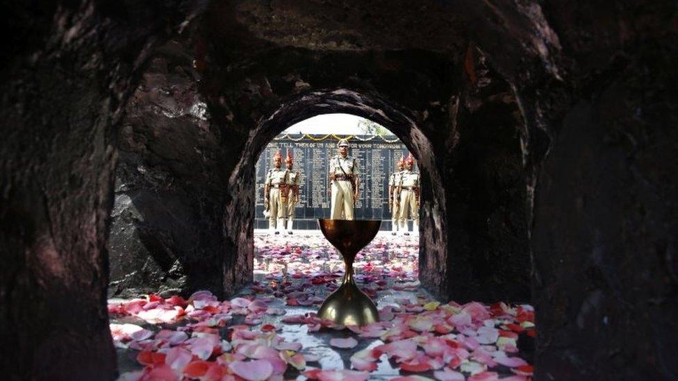 Indian Border Security Force (BSF) soldiers pay homage to slain soldiers who lost their lives in Kargil War at a war memorial, inside a Border Security Force headquarter in Humhama on the outskirts of Srinagar, the summer capital of Indian Kashmir, 23 July 2019.