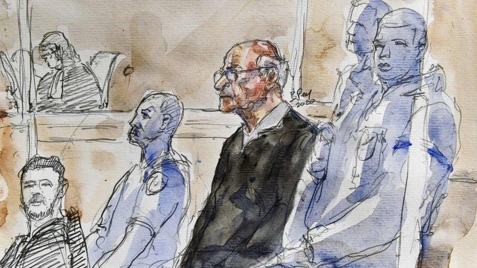 A court sketch shows Joël Le Scouarnec, (centre) sitting in the courtroom in Saintes, France. Photo: 13 March 2020