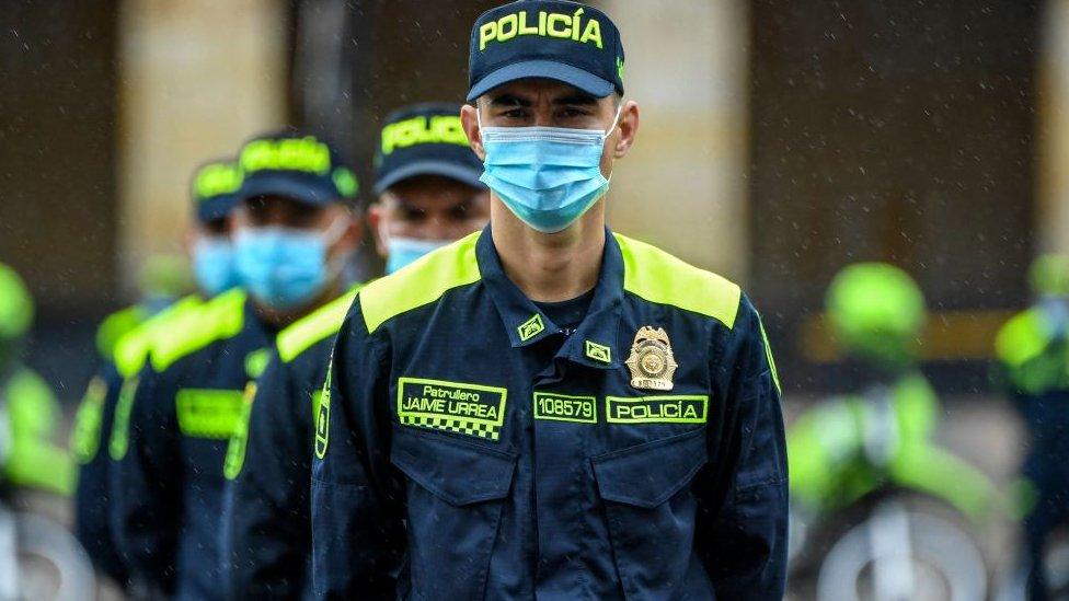 Members of the national police attend a ceremony for the presentation of new uniforms at the Bolivar square in Bogota on July 19, 2021. - Colombia launched new police uniforms in the framework of a reform plan of President Ivan Duque amid heavy criticism after anti-government protests left at least 60 people dead.