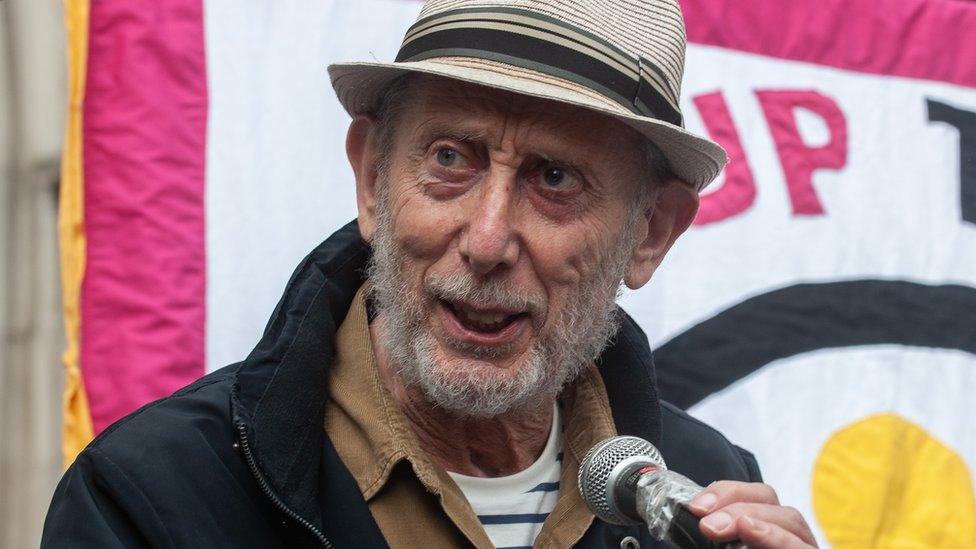 Author Michael Rosen addresses the demonstration as hundreds of people gather outside the High Court to protest against the Rwanda deportation proposal on September 5, 2022 in London