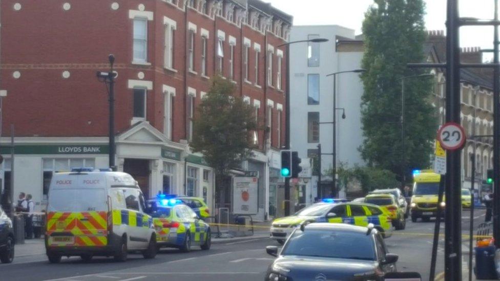 Crime scene in Sydenham Road, south-east London, after a man in his twenties was found with gunshot wounds