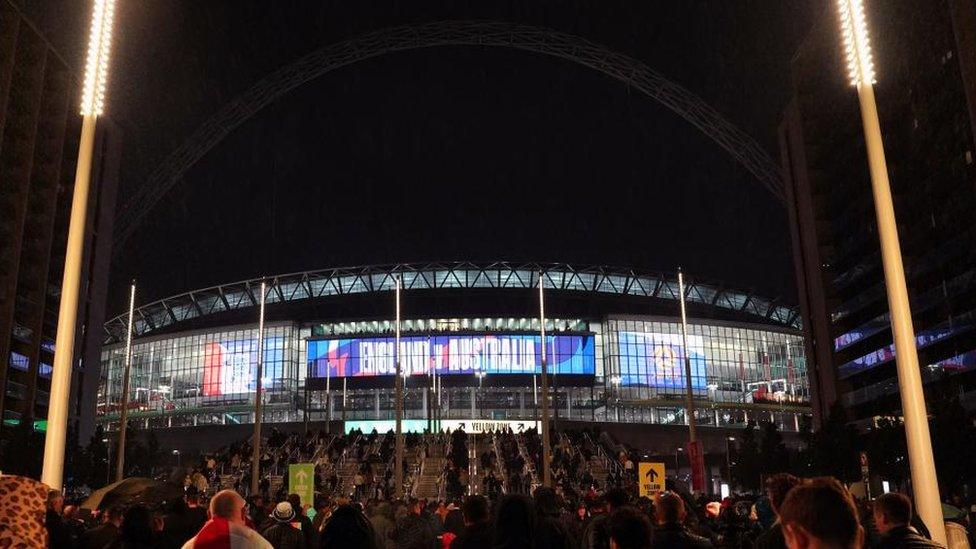 A general view of the arch over Wembley Stadium as crowds arrive for England's friendly against Australia on Friday. The arch is not lit up.