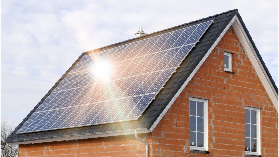 A house roof covered in solar panels