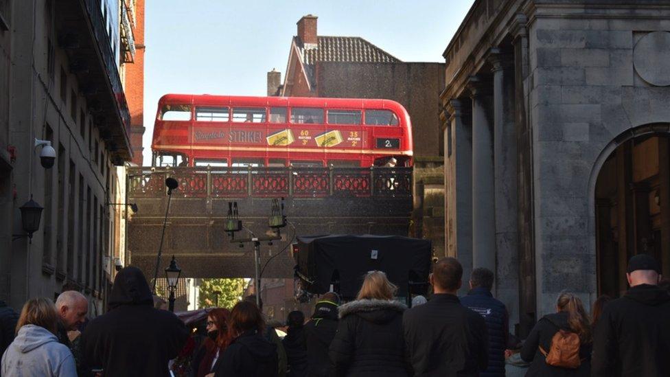 Image of a vintage double decker red bus.