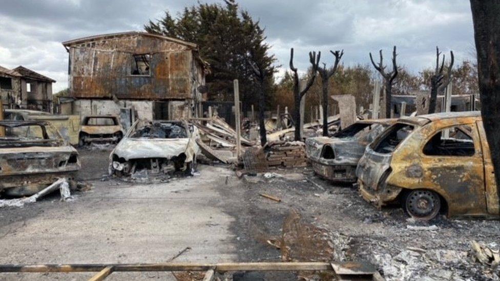 Cars destroyed at a garage in Wennington