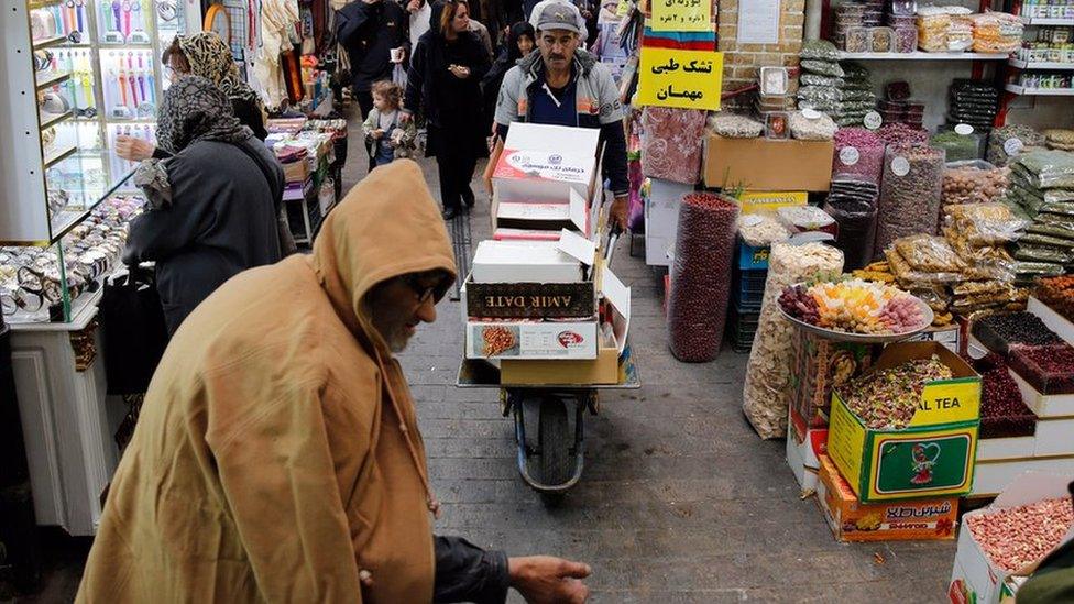 Iranians shop in a bazaar in Tehran, Iran, 5 November 2018