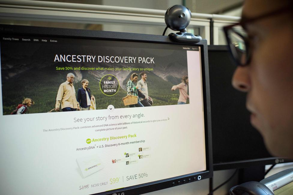 Man looking at DNA testing kit deal online