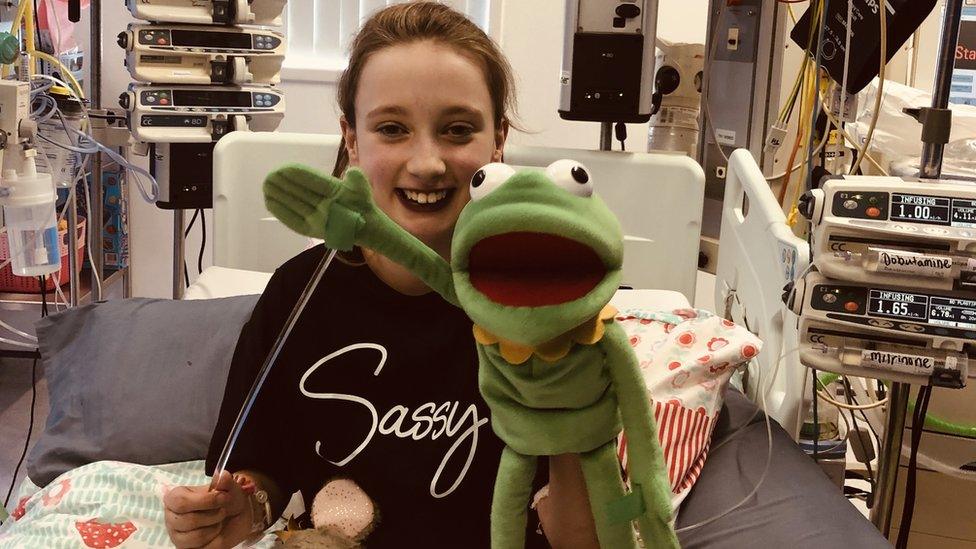 Aimee Brady with her Kermit the frog puppet