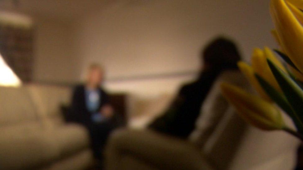 Clare, blurred to preserve anonymity, is interviewed