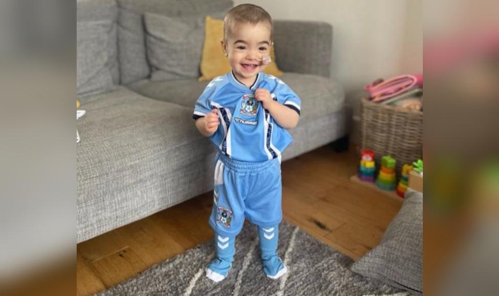 Hallie wearing Coventry City children's kit