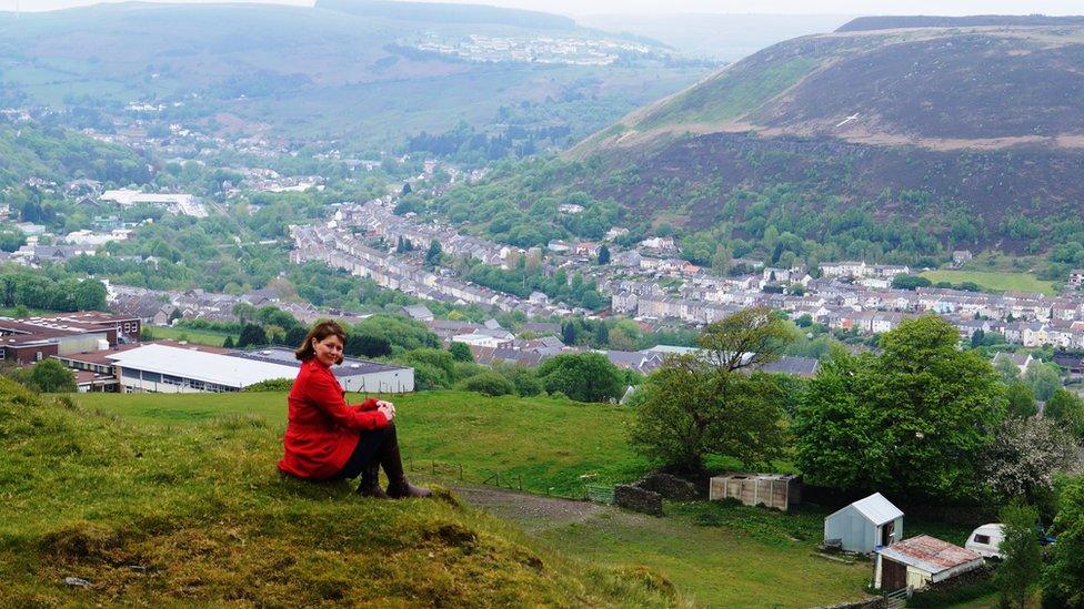 Leanne Wood sitting above the village of Penygraig in the Rhondda Valley