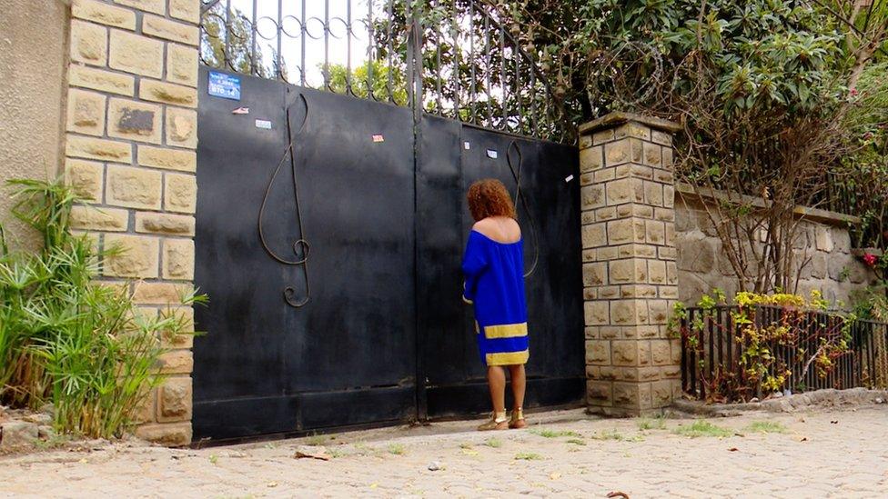 Hamelmal Abate at the gate to the house she is giving to become a quarantine centre in Addis Ababa