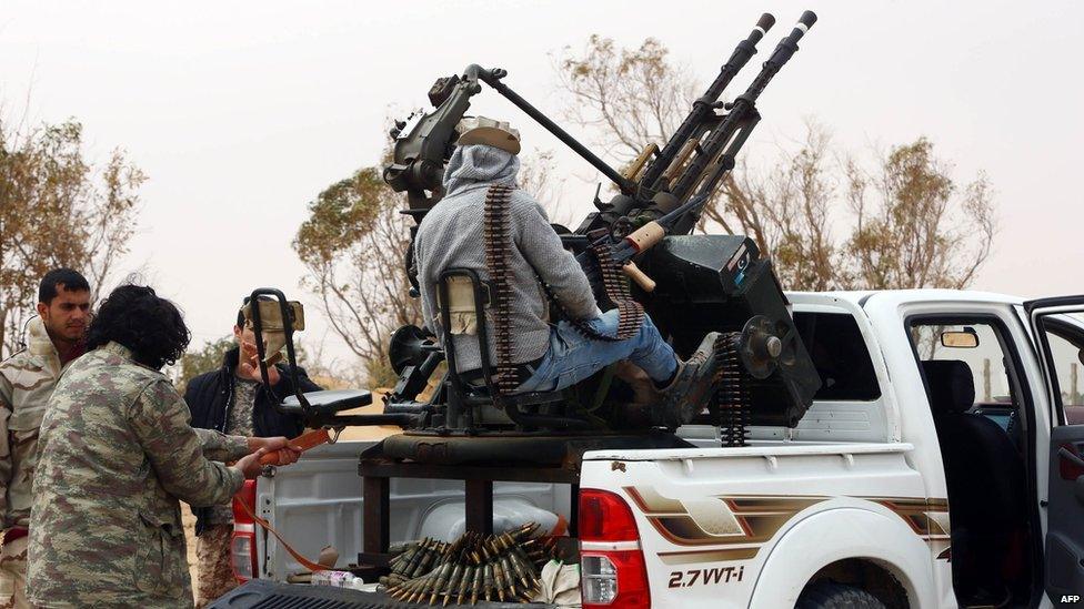 Members of forces loyal to Libya's Islamist-backed parliament General National Congress (GNC) prepare to launch attacks as they continue to fight Islamic State (IS) group jihadists on the outskirts of Libya's western city of Sirte