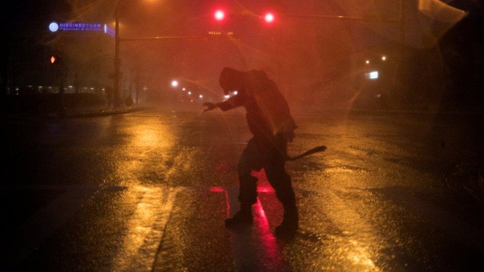 Stewart Adams, of San Marcos, Texas, battles the winds in Corpus Christi U.S. on 25 August, 2017