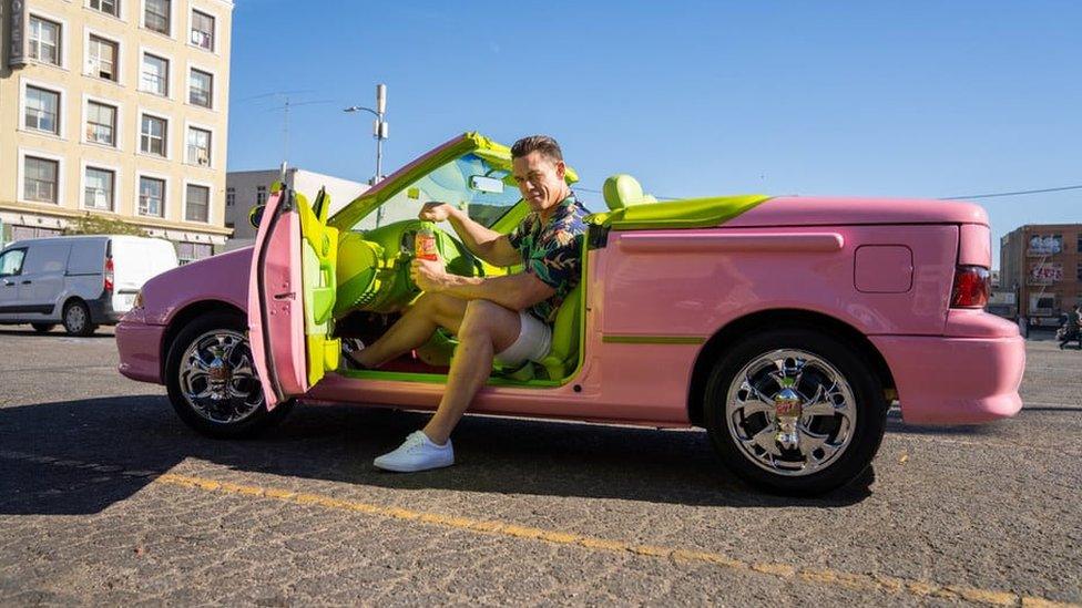 John Cena in a pink car.