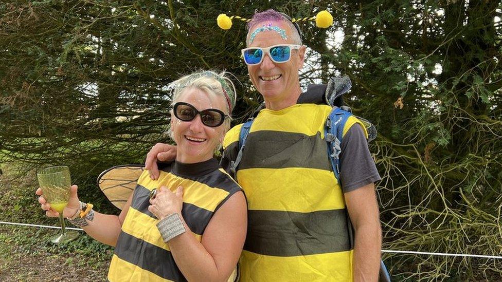 Couple dressed up in bee costumes at the festival