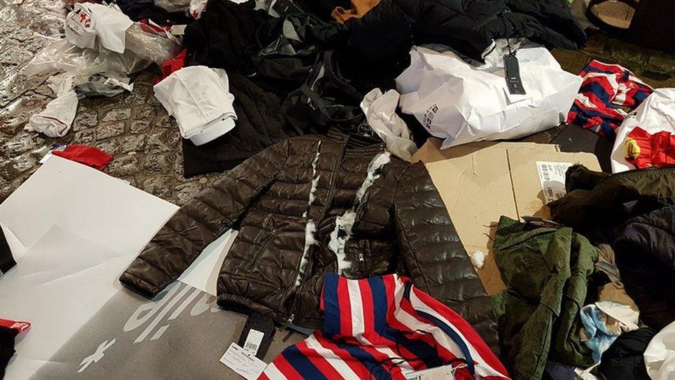 Close-up shot of torn clothes abandoned on the pavements in Rouen