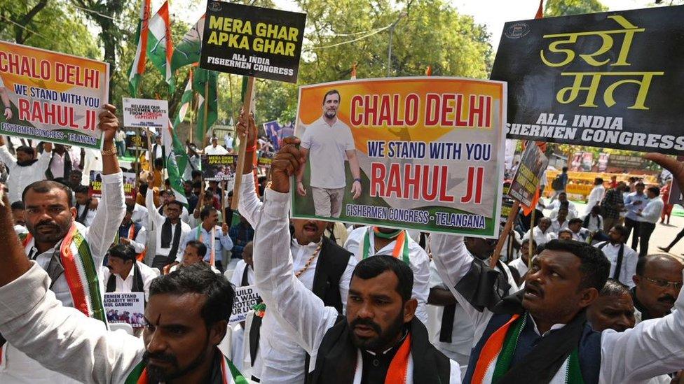 Activists of All India Fishermen Congress take part in a protest against the disqualification of India's Congress party leader Rahul Gandhi from the Indian parliament after his conviction in a defamation case, in New Delhi on April 3, 2023.