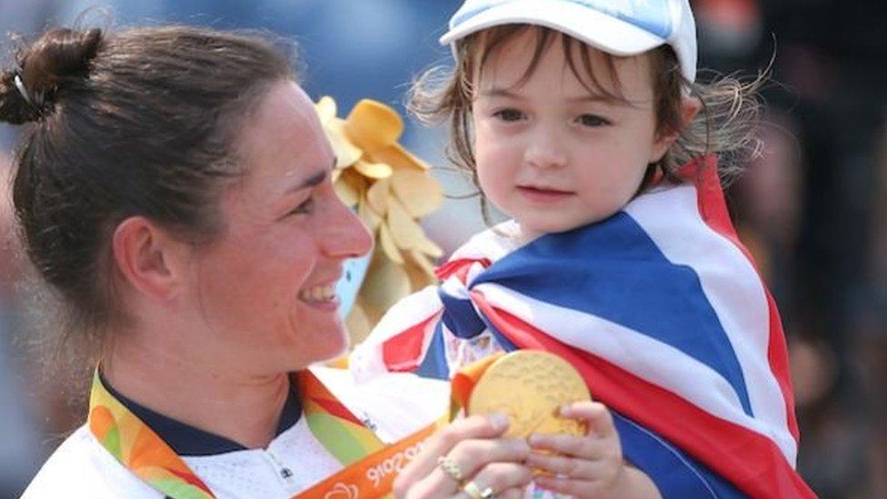 Sarah Storey and her daughter Louisa hold her gold medal at the Rio 2016 Paralympics