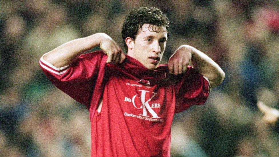 Robbie Fowler of Liverpool shows his support for the dockers strikes during the European Cup Winners Cup quarter-final match against SK Brann played at Anfield, in Liverpool, England. Liverpool won the match 3-0.