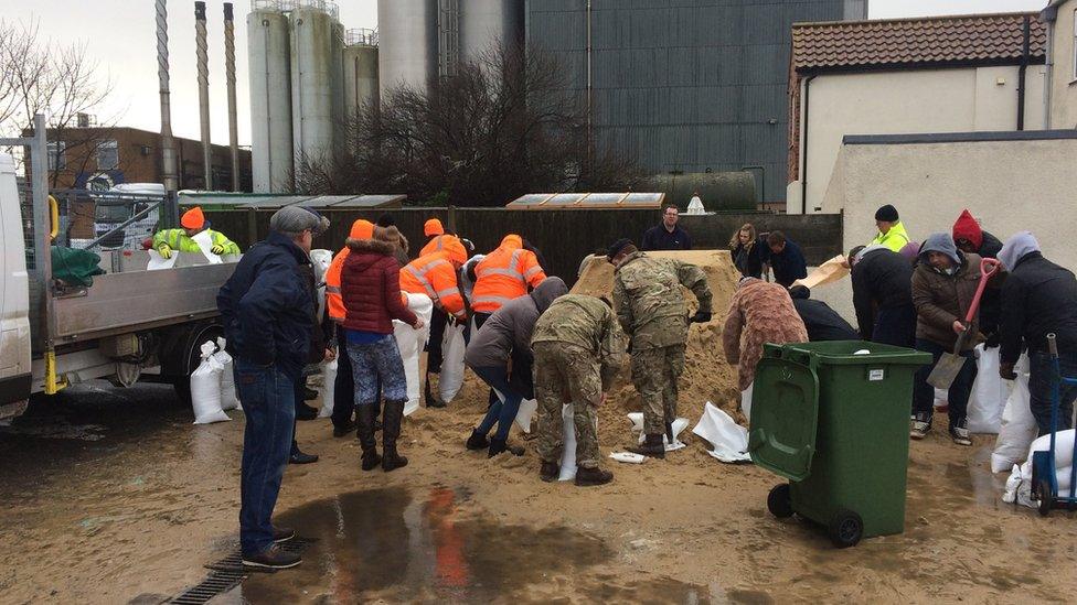 Volunteers bagging up sand at Great Yarmouth