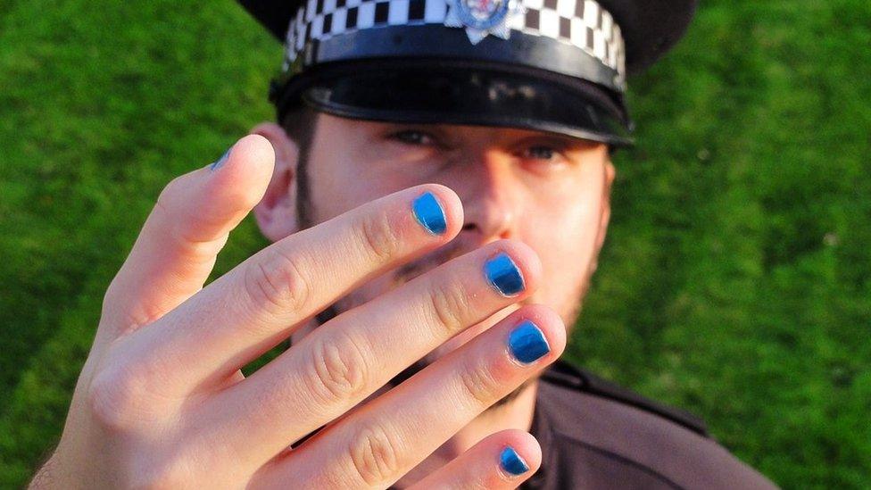 Police officer with painted nails