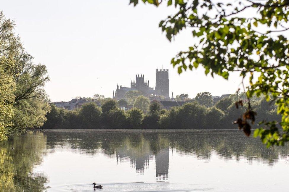 A church reflected in water