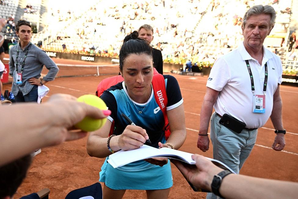 May 13, 2022 Tunisia"s Ons Jabeur signs autographs for fans after winning her quarter final match against Greece"s Maria Sakkari