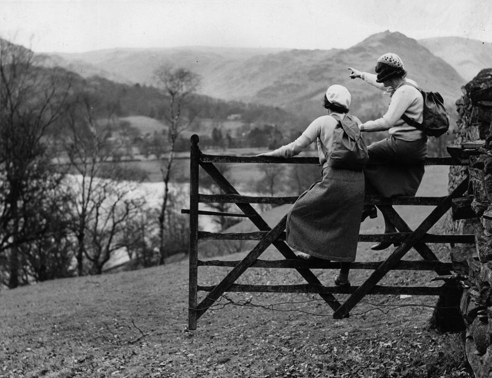 13th April 1935: Hikers viewing the scenery from the famous Wishing Gate at Grasmere in the Lake District.