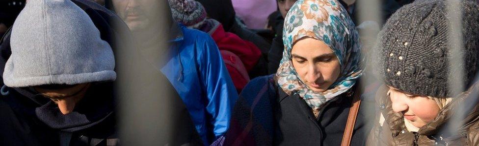 Migrants wait to be allowed to cross the border from Slovenia, in Spielfeld, Austria