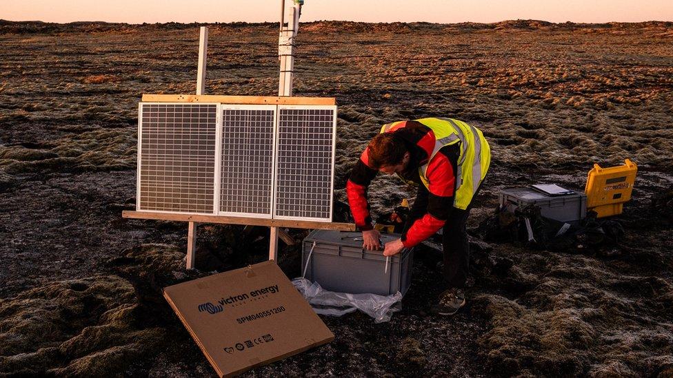 Dr Tom Winder installs a seismograph