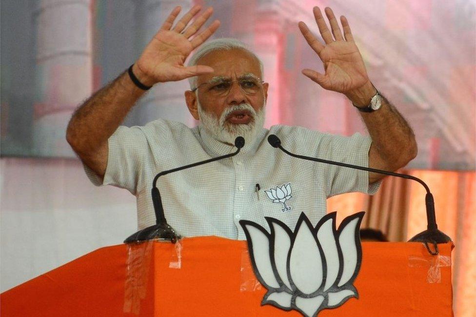 Indian Prime Minister Narendra Modi gestures during a rally in Amreli, some 250km from Ahmedabad, on April 18, 2019