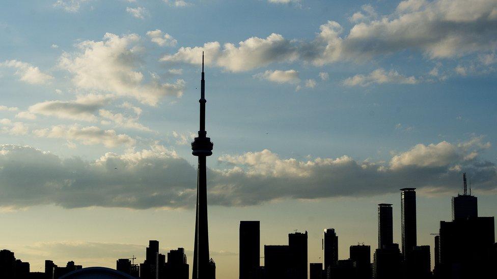 A silhouetted view of the skyline in Toronto, Ontario, on July 10, 2015