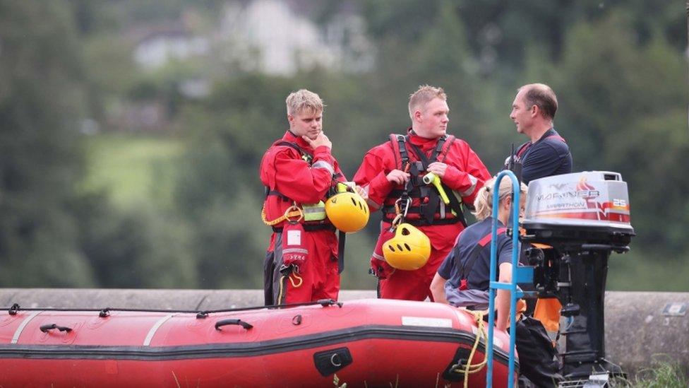 Rescuers and a boat