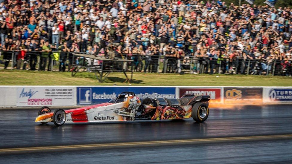 A car racing at Santa Pod