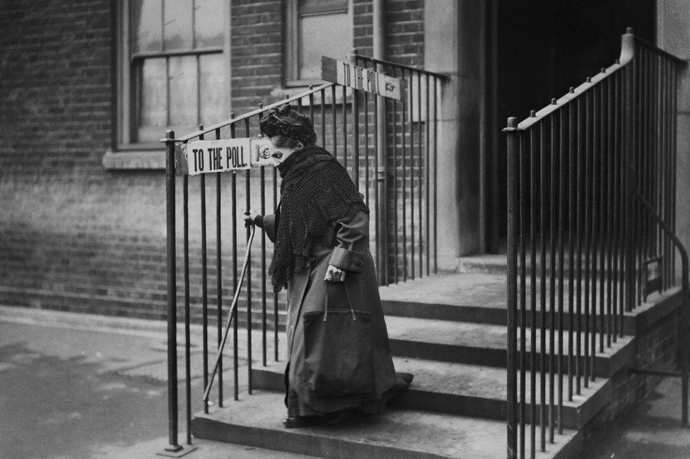 Woman leaves polling station in Islington