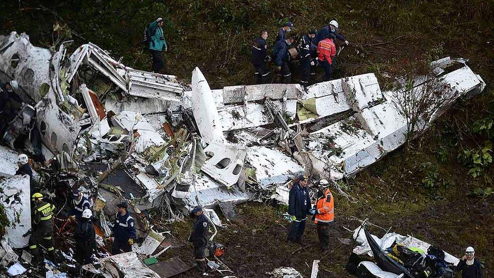 Rescuers search for survivors from the wreckage of the Lamia airlines charter plane carrying members of the Chapecoense football team that crashed in the mountains of Cerro Gordo